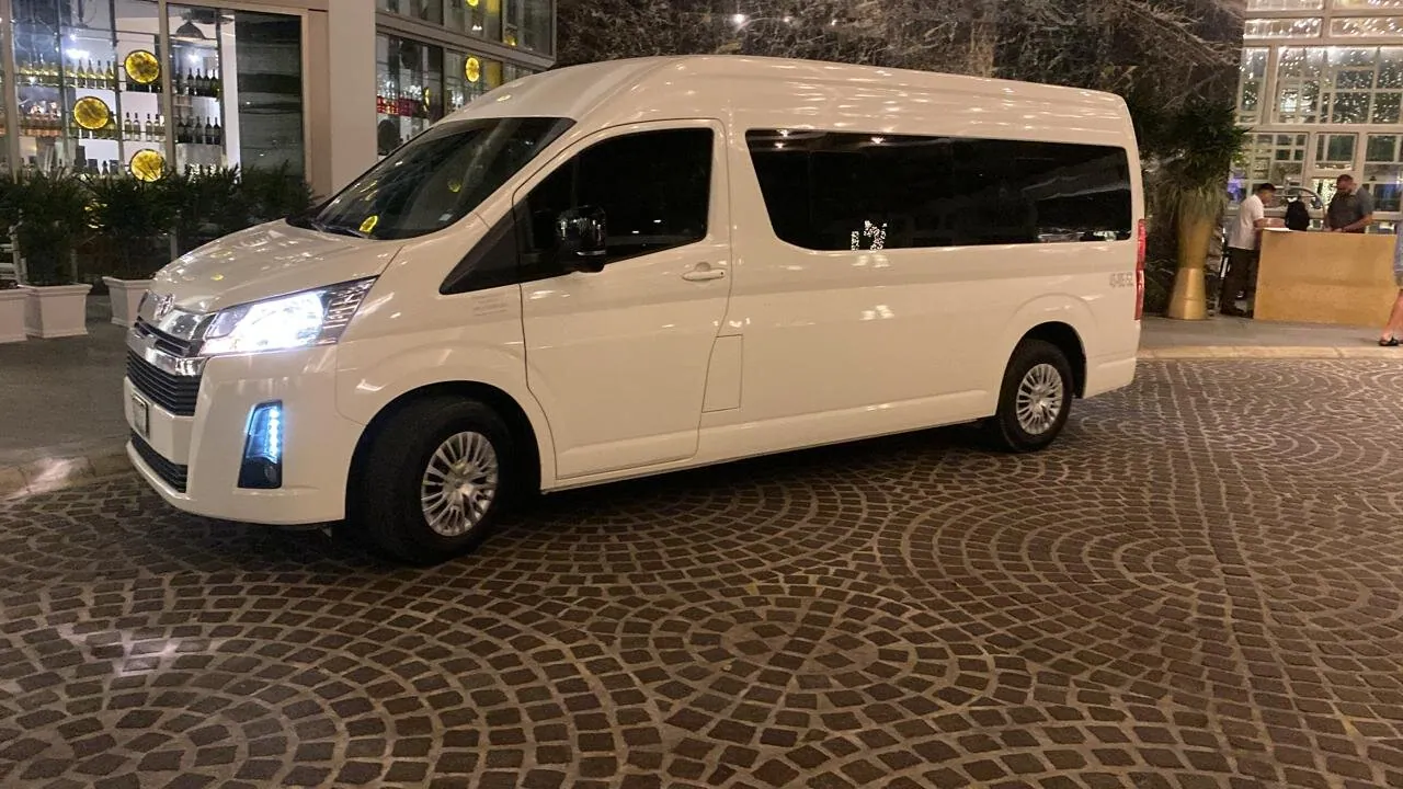Real Toyota Hiace used for private Tours Aldea transportation, photographed outside in the evening