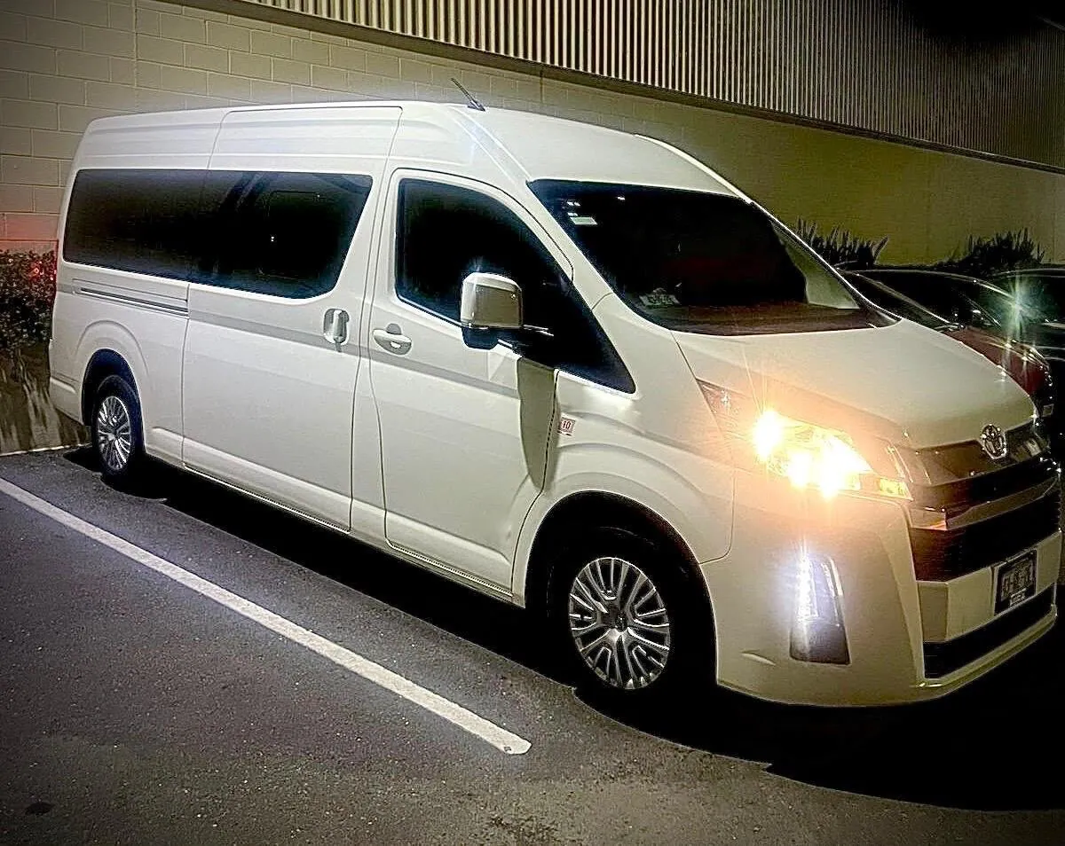 Side view of the actual Toyota Hiace available for Tours Aldea private tours